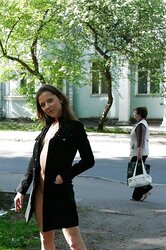 Teenager dark-haired demonstrating in the street