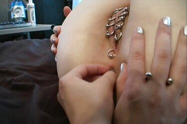Shaven sapphic with dozen of piercings