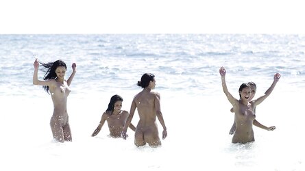 5 bare women at the beach