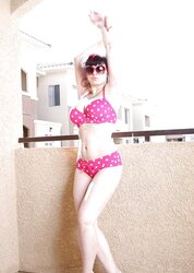 BUXOMY BATHING SUIT CHICK ON BALCONY