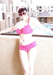 BUXOMY BATHING SUIT CHICK ON BALCONY