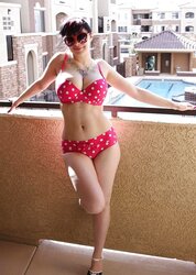 BUXOMY BATHING SUIT CHICK ON BALCONY