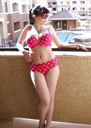 BUXOMY BATHING SUIT CHICK ON BALCONY