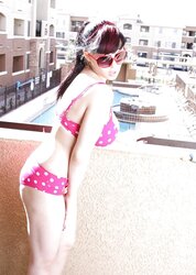 BUXOMY BATHING SUIT CHICK ON BALCONY