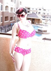 BUXOMY BATHING SUIT CHICK ON BALCONY