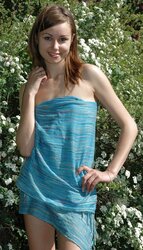 Uber-Cute teenager Anfisa with little fun bags posing on the nature