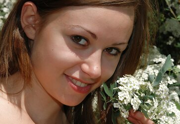Uber-Cute teenager Anfisa with little fun bags posing on the nature