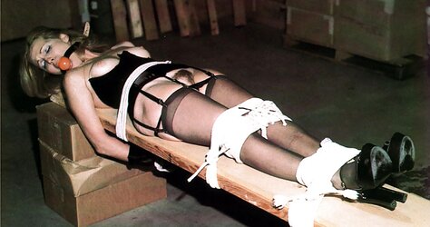 Vintage female being strapped down