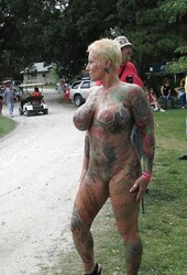 Tatted huge mature exhibitionist