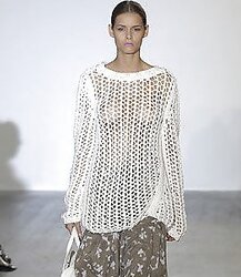 Nymphs sans brassiere under sheer half-shirt