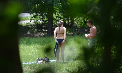 Lady sunbathing in the park I