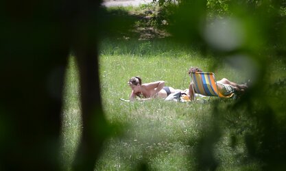 Lady sunbathing in the park I