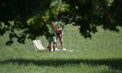 Lady sunbathing in the park I