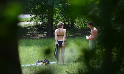 Lady sunbathing in the park I