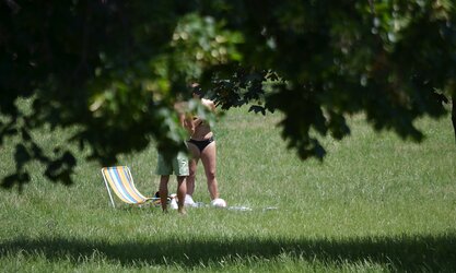 Lady sunbathing in the park I