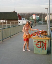 Posing bare in a public place