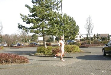 Posing bare in a public place