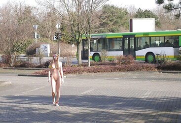 Posing bare in a public place