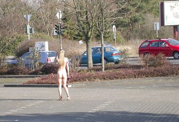 Posing bare in a public place