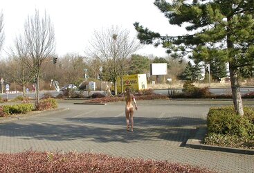 Posing bare in a public place