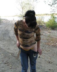 Lili bare on a public beach