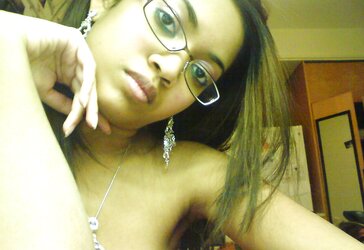 Luxurious Dark-Hued Female With Glasses