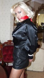 Light-Haired roped up wearing leather miniskirt and high high-heeled slippers
