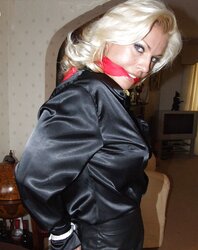 Light-Haired roped up wearing leather miniskirt and high high-heeled slippers