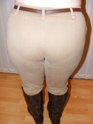 Jodhpurs, footwear and railing whip