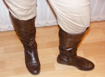 Jodhpurs, footwear and railing whip