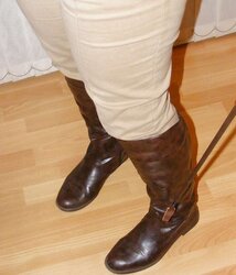Jodhpurs, footwear and railing whip