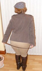 Jodhpurs, footwear and railing whip