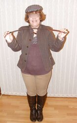 Jodhpurs, footwear and railing whip