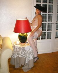 Gorgeous Female Opium in pantyhose and high-heeled slippers