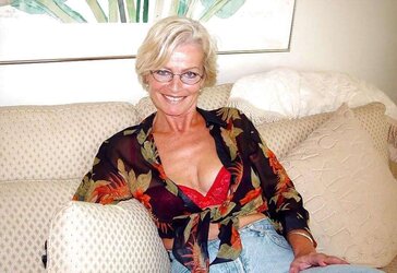 Justine a mature platinum-blonde disrobing in the Living Apartment