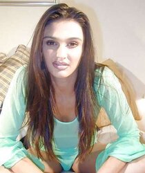 Kavitha sidhu green clothes on sofa