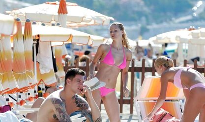 Michelle Hunziker rosy Bathing Suit on the beach in Varigotti