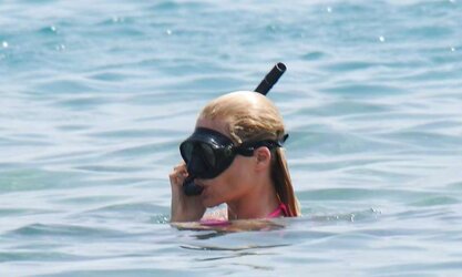 Michelle Hunziker rosy Bathing Suit on the beach in Varigotti