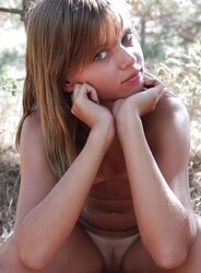Nude ultra-cute teenager at the woods
