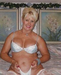 A mature female in underwear is twice as molten