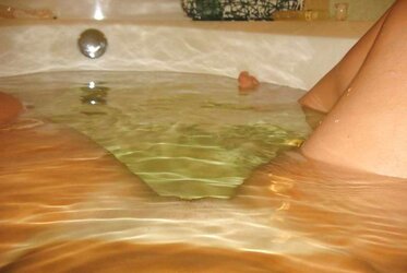 HUGE-BOOBED DAME IN TUB