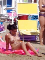 Dolls sunbathing on italian beach of the adriatic coast